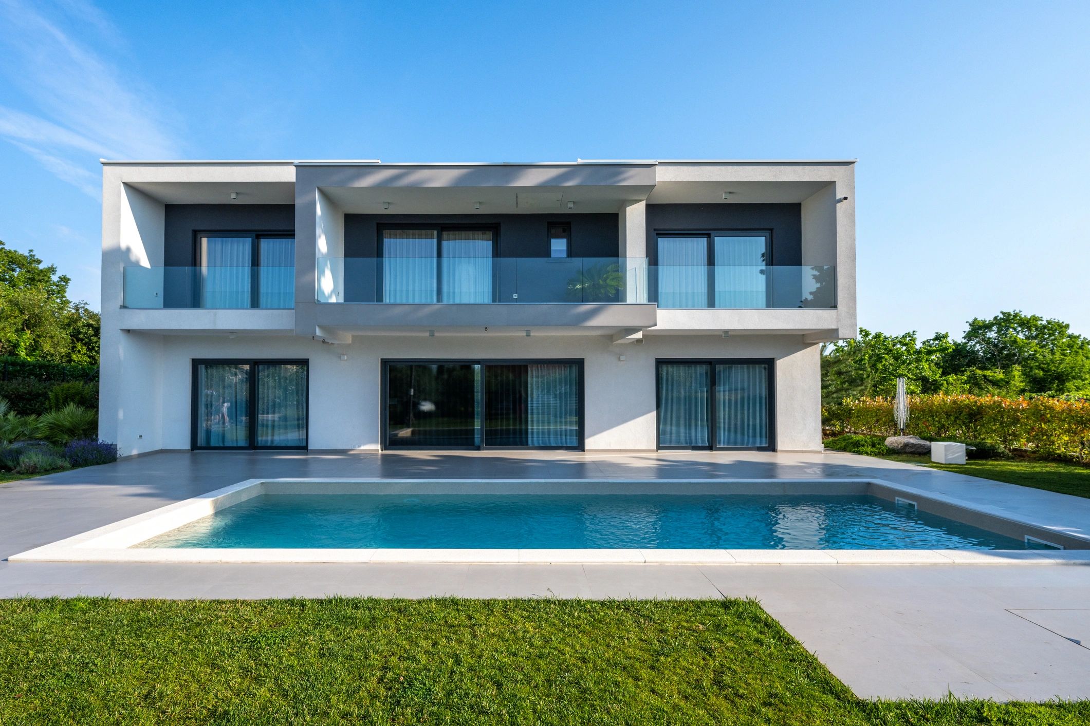 Modern rendered house exterior showing clean facade finish
